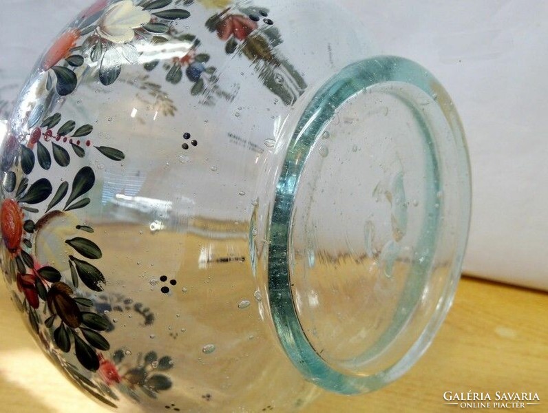 Antique glasswork artefact. A broken wine jug with richly painted bubble inclusions