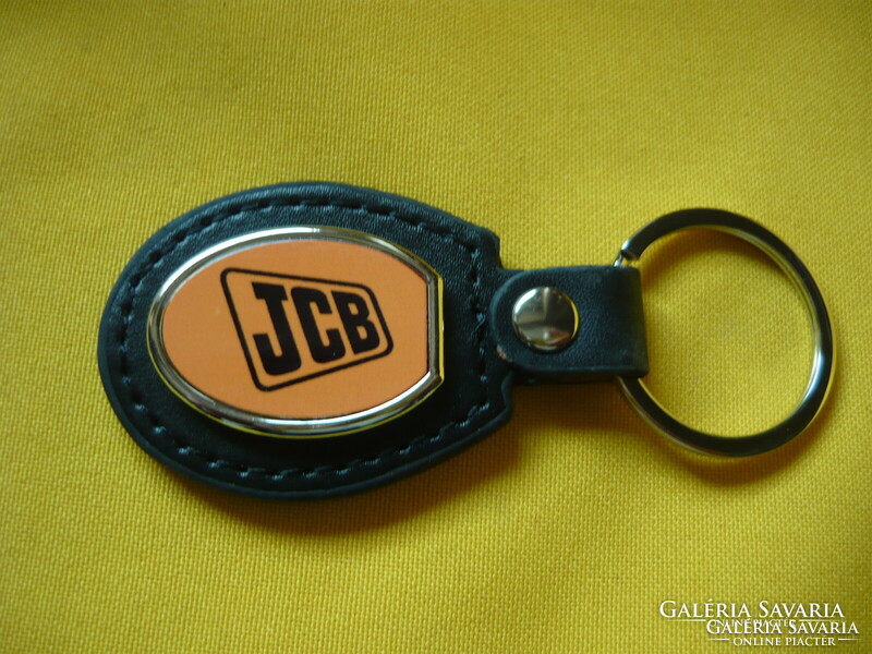 Jcb metal key ring on a leather base