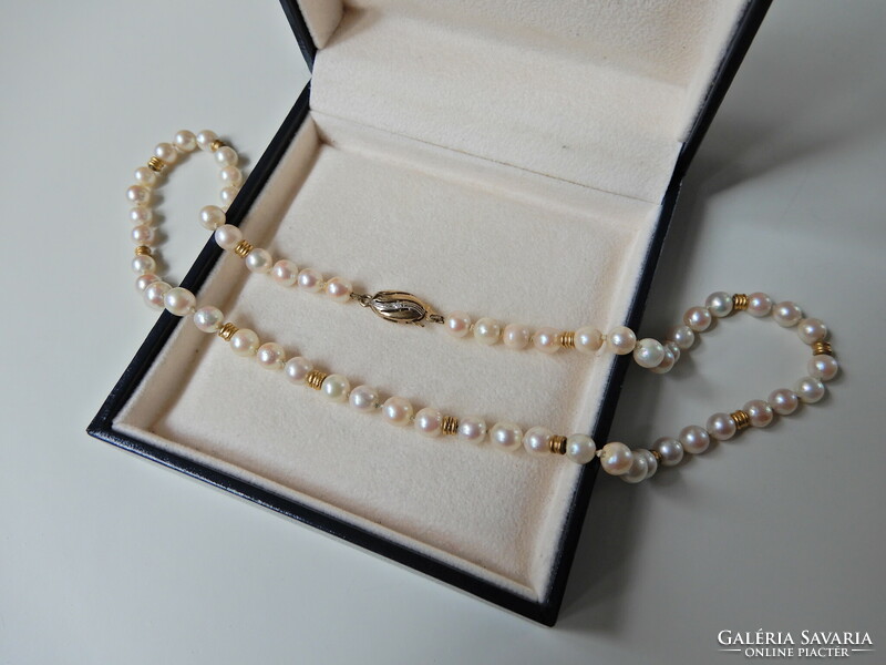 Old string of real pearls with 8 carat gold lock and diamonds