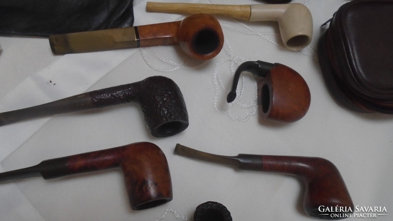 A collection of old pipes and the related tools together