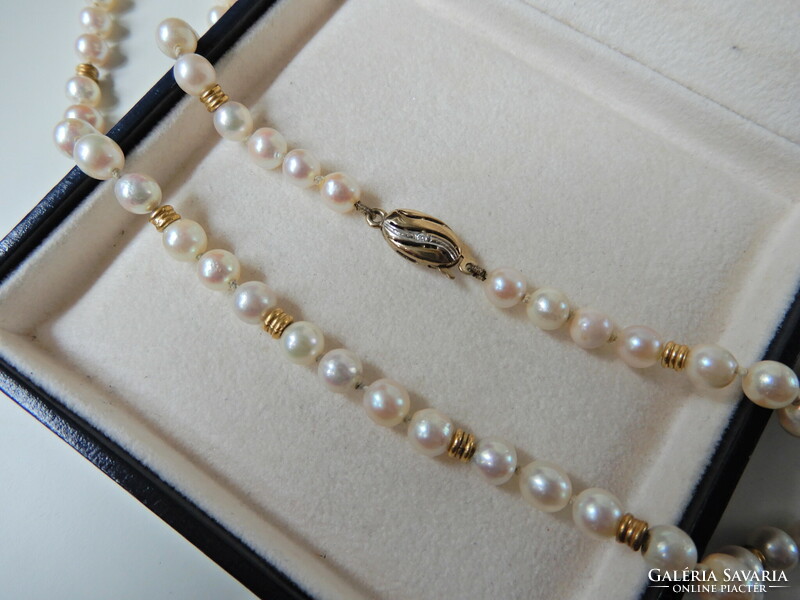 Old string of real pearls with 8 carat gold lock and diamonds