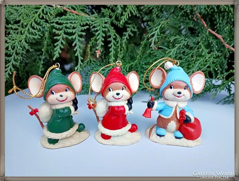 Painted, solid, hanging Christmas tree decorations, mice in winter clothes.