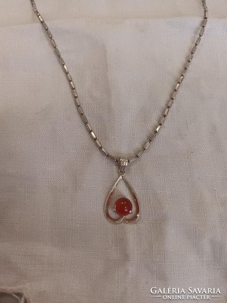 For sale, a lovely old handmade silver chain with a silver carnelian stone pendant!