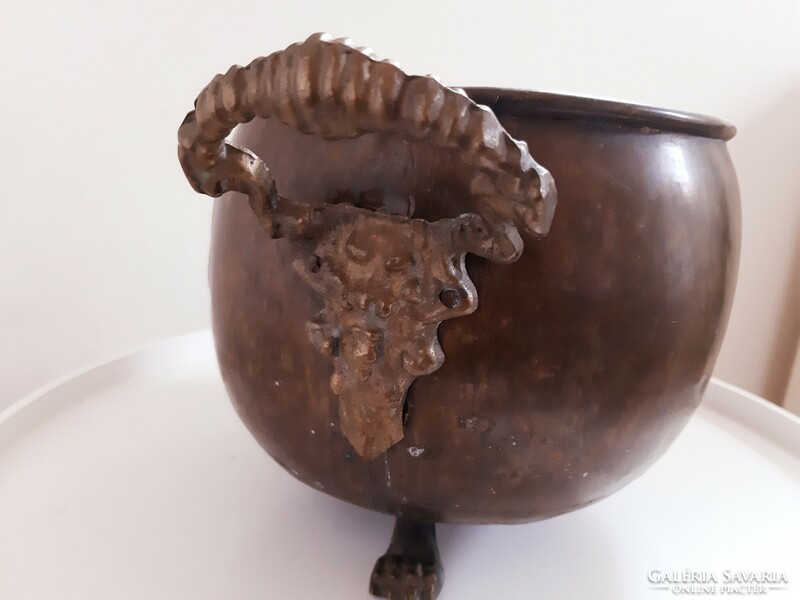 Copper cauldron with lion's head