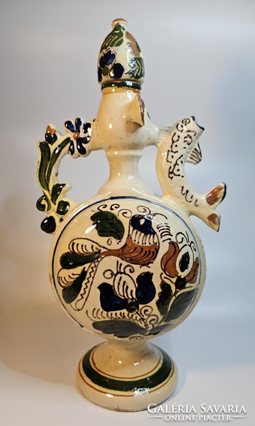 Ceramic jug with folk motifs