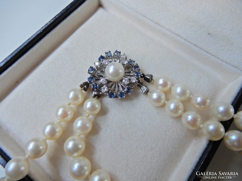 Two rows of genuine Akoya pearls with white gold clasp, sapphire stones and diamonds