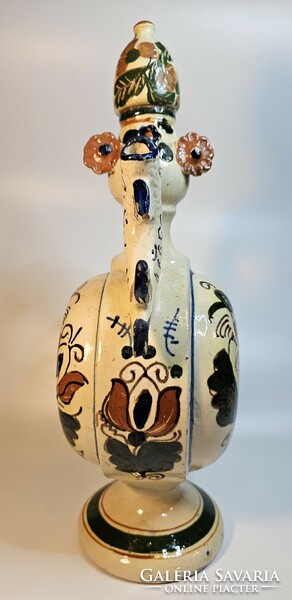 Ceramic jug with folk motifs