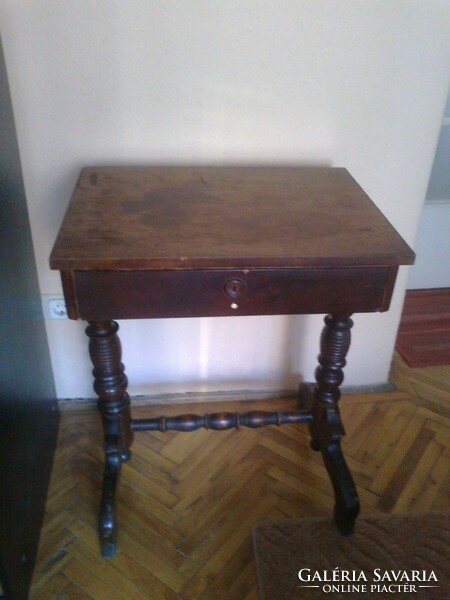 A pretty little pewter sewing table