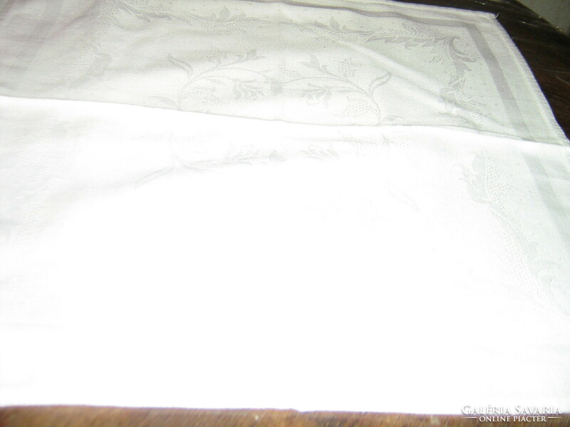 A beautiful damask napkin with a white Toledo flower pattern
