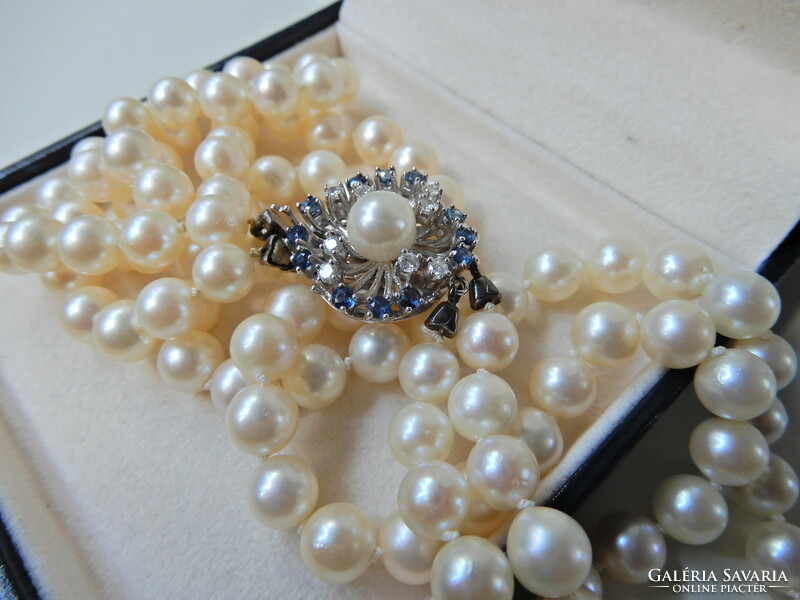 Two rows of genuine Akoya pearls with white gold clasp, sapphire stones and diamonds