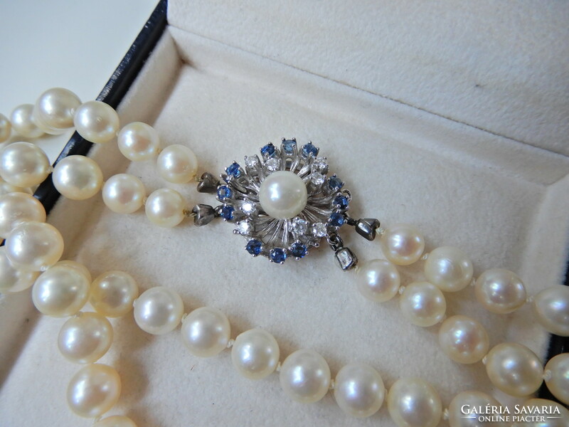 Two rows of genuine Akoya pearls with white gold clasp, sapphire stones and diamonds