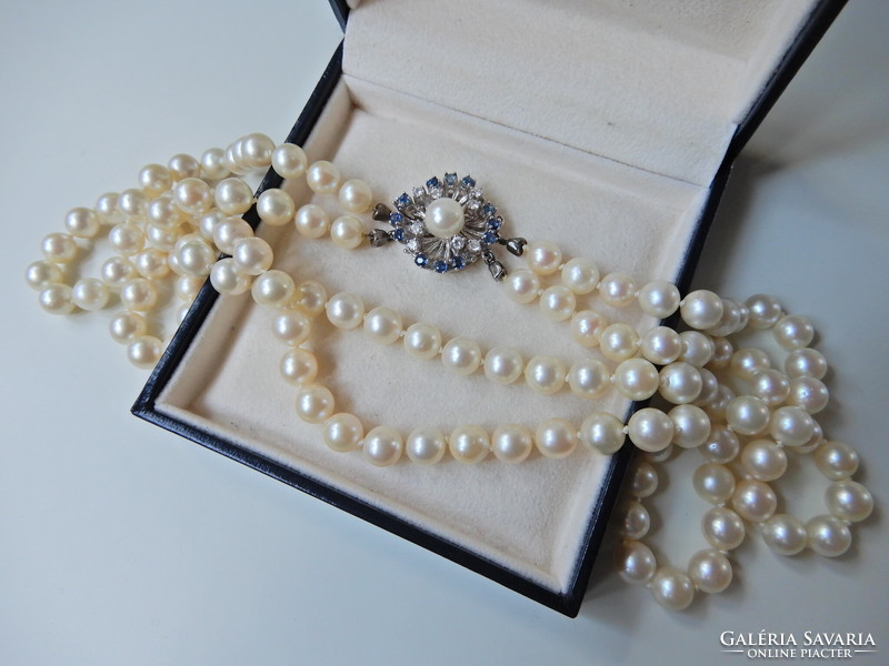 Two rows of genuine Akoya pearls with white gold clasp, sapphire stones and diamonds