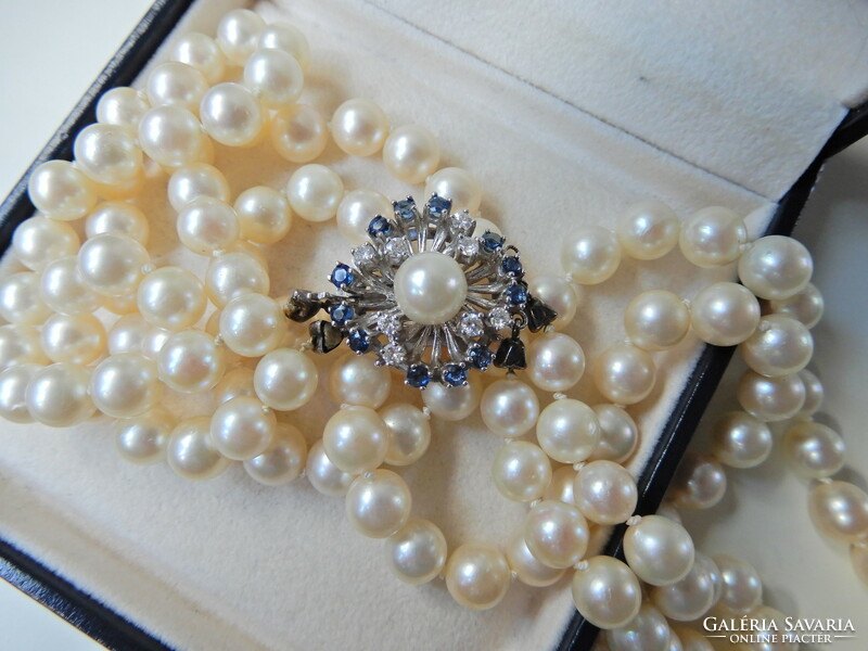 Two rows of genuine Akoya pearls with white gold clasp, sapphire stones and diamonds