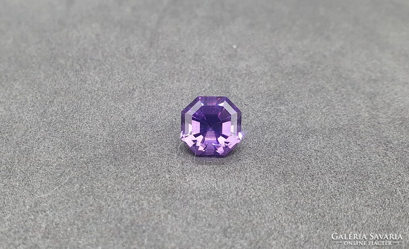 The stone of the month is an amethyst emerald cut 5.21 Carats. With certification.