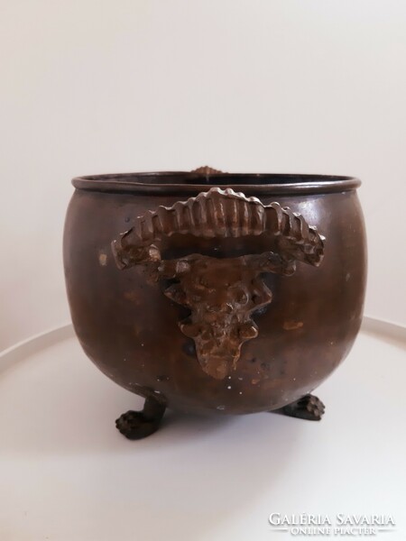 Copper cauldron with lion's head
