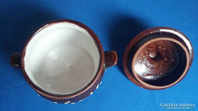 Ceramic container with brown glaze and white pattern