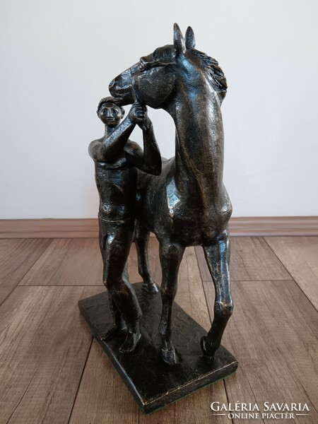 Old bronze statue of a boy with a horse, Croatian