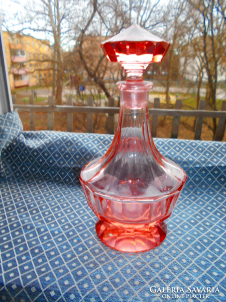 Peach-pink faceted glass bottle