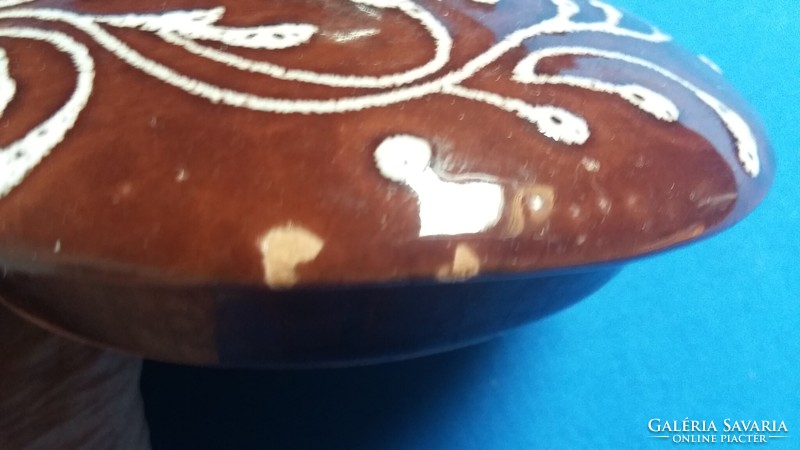 Ceramic container with brown glaze and white pattern