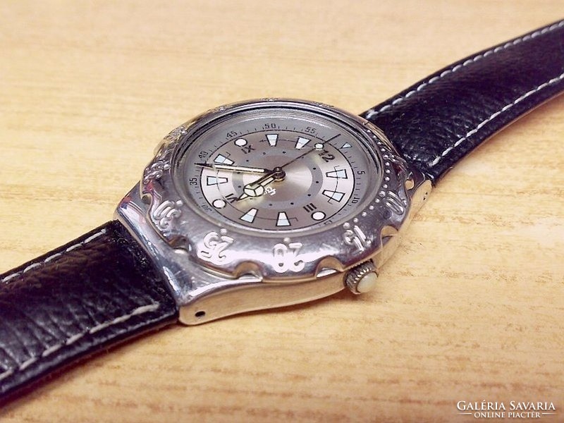 Swiss swatch quartz wristwatch with chrome casing, rotating bezel, leather strap