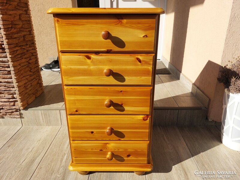 A 5-drawer pine chest of drawers for sale. Furniture is beautiful, in like-new condition.