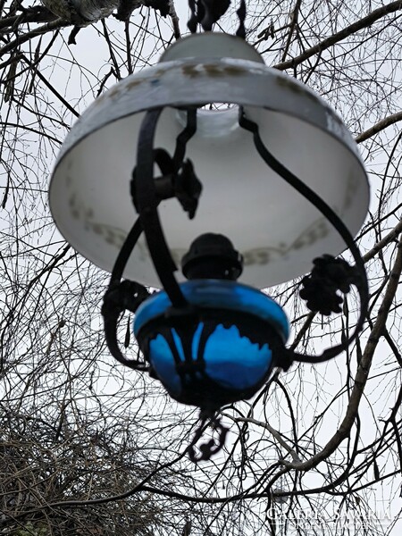 Antique petroleum chandelier lamp, wrought iron, milk glass shade. . Even electrified if you put a light bulb in the bulb