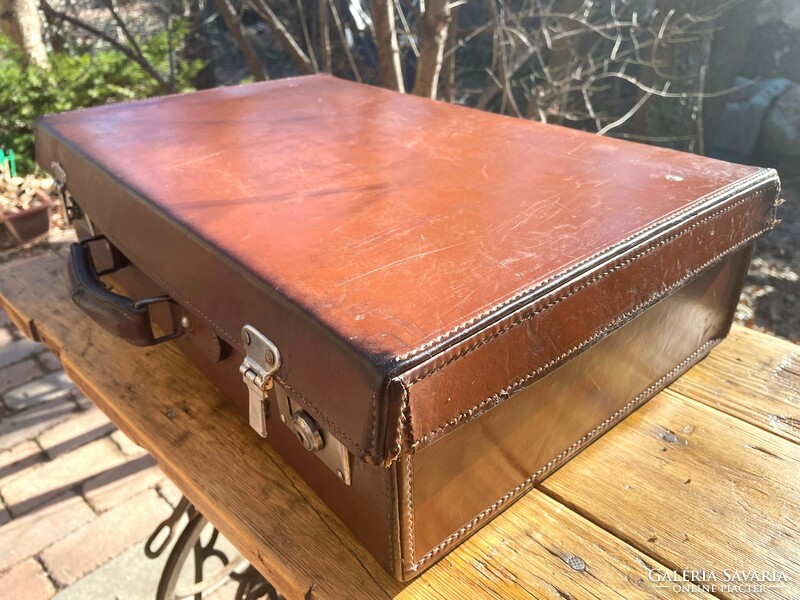 Old brown leather suitcase, retro suitcase - a suitcase from the first half of the last century