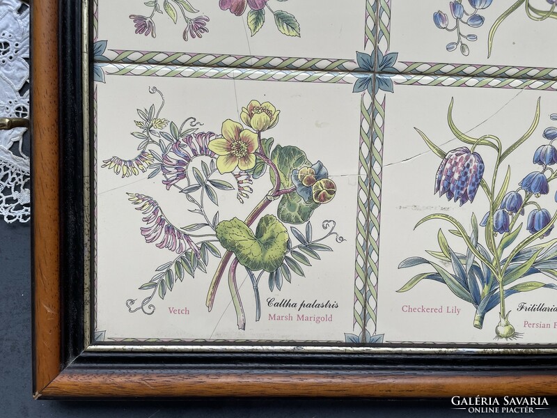 A special old tray with copper handles and a wooden frame with tile inlays