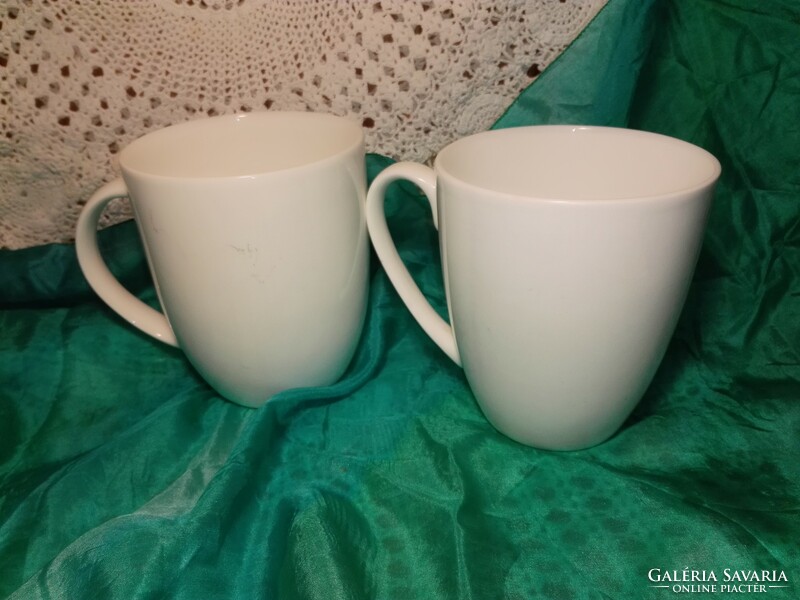Snow-white porcelain cup, mug.