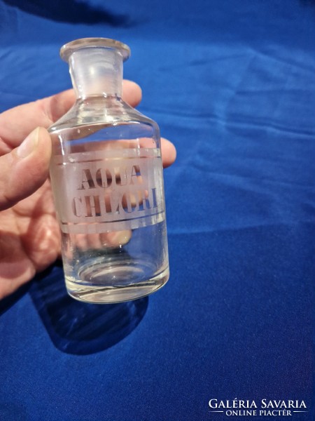 Glass stoppered pharmacy bottle with Aqua Chlori inscription
