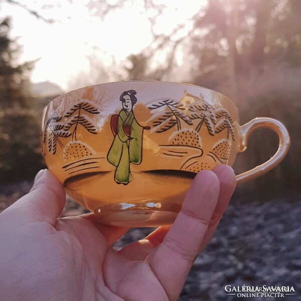 Oriental geisha eggshell porcelain tea cup and saucer