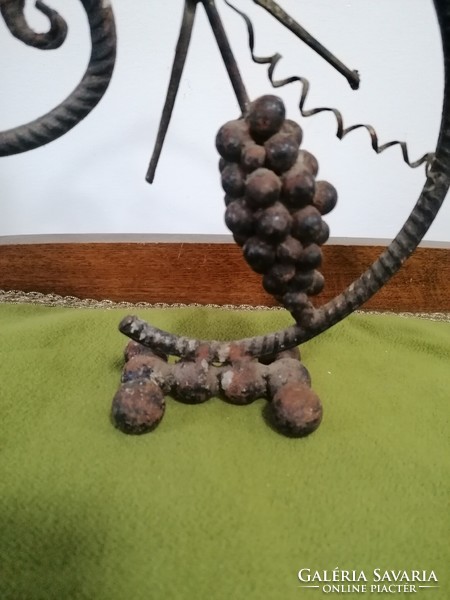 Forged candle holder with grape motif, folk style