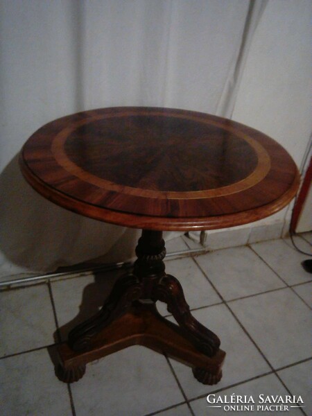 Carved walnut inlaid three-legged table