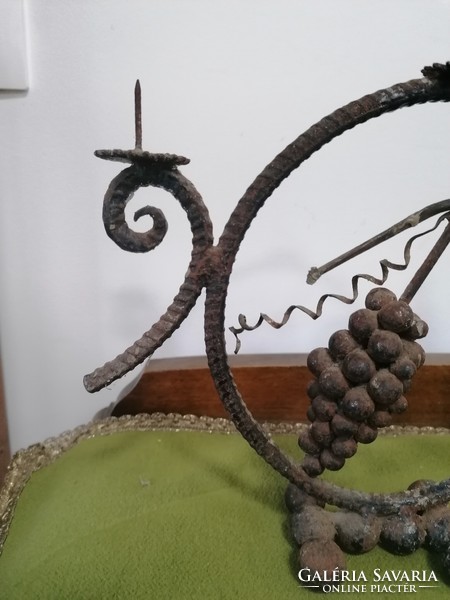 Forged candle holder with grape motif, folk style