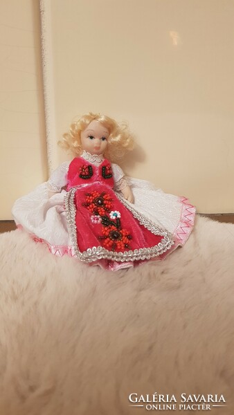 Porcelain head doll in folk costume