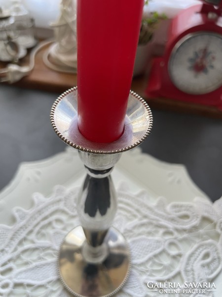 Old, heavy silver-plated candlestick, decorated with a string of pearls pattern