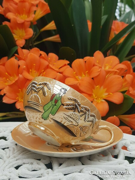 Oriental geisha eggshell porcelain tea cup and saucer