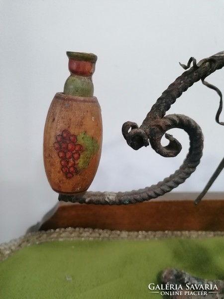 Forged candle holder with grape motif, folk style