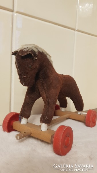 Antique horse figure wheeled toy
