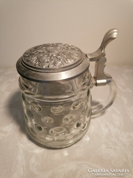 Beer mug with a glass body, protruding material, whose tin lid also has a convex pattern. Marked bmf.