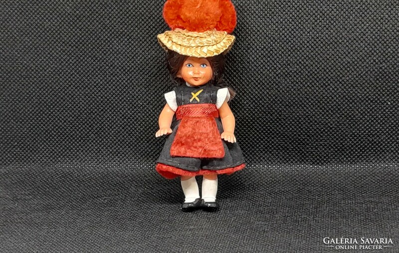 Retro doll house rubber doll in folk costume