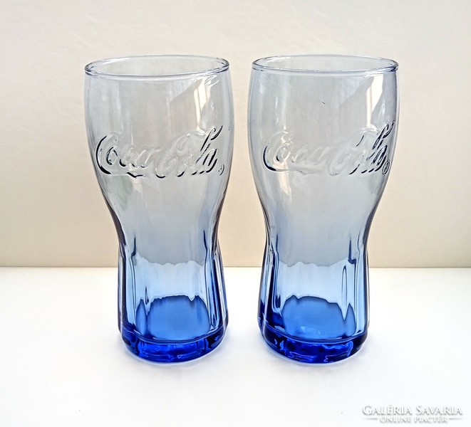 2 blue coca-cola glasses together