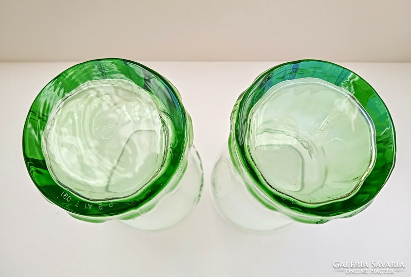 2 green coca-cola glasses together