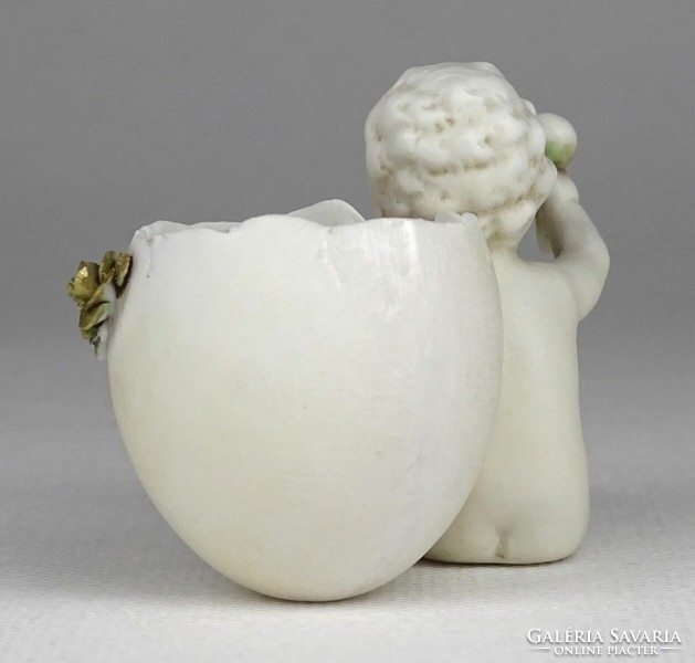1Q347 antique small marked biscuit with putto drum and egg