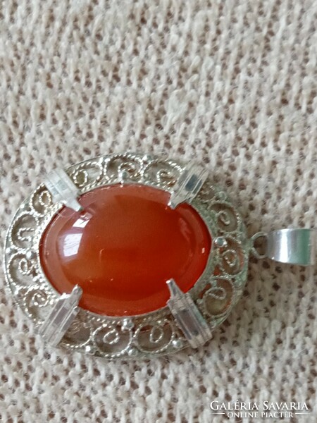 Filigree silver pendant with amber stones