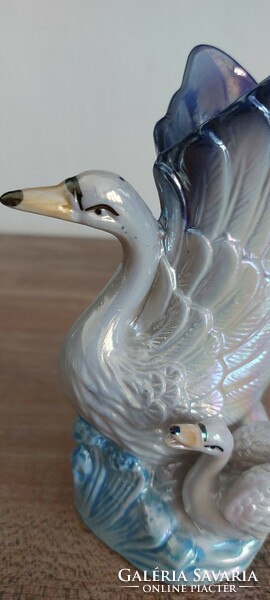 Iridescent porcelain vase depicting a swan and chick, 14 cm high