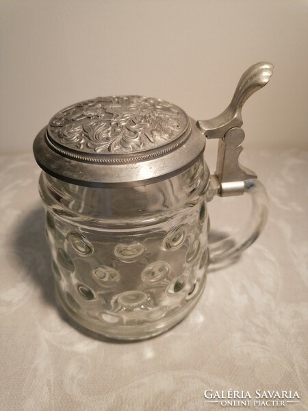 Beer mug with a glass body, protruding material, whose tin lid also has a convex pattern. Marked bmf.