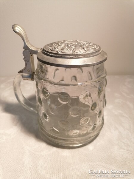 Beer mug with a glass body, protruding material, whose tin lid also has a convex pattern. Marked bmf.