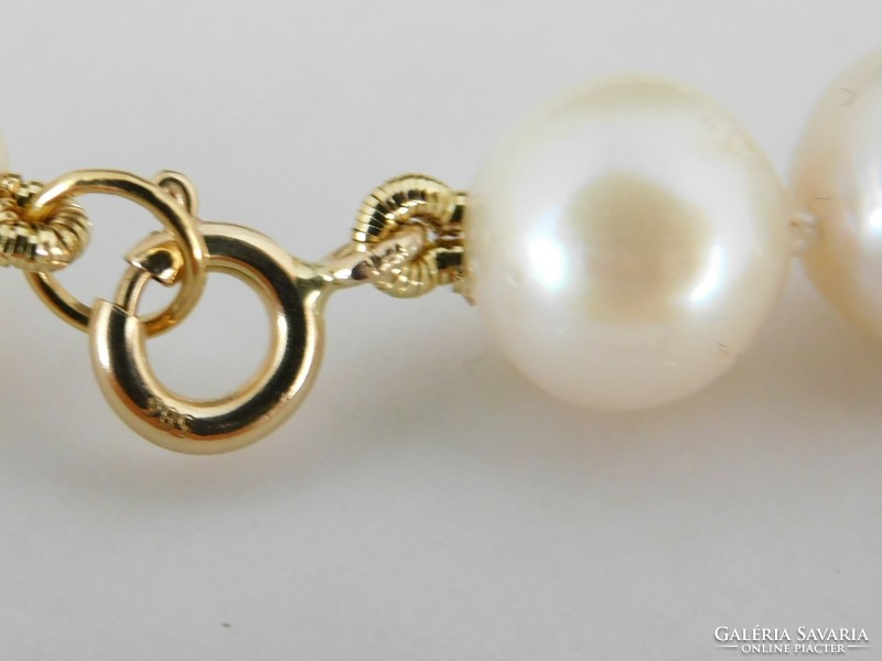 14 K gold pearl bracelet 9.5 Mm large pearls