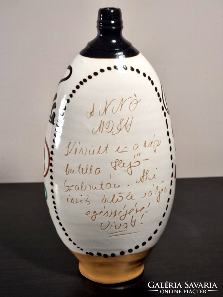 Glazed bottle with Mezőcsát painting with bird inscription dated 1981.
